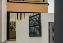 Former civil servant among two charged in money laundering case Law Courts Building in Grand Cayman