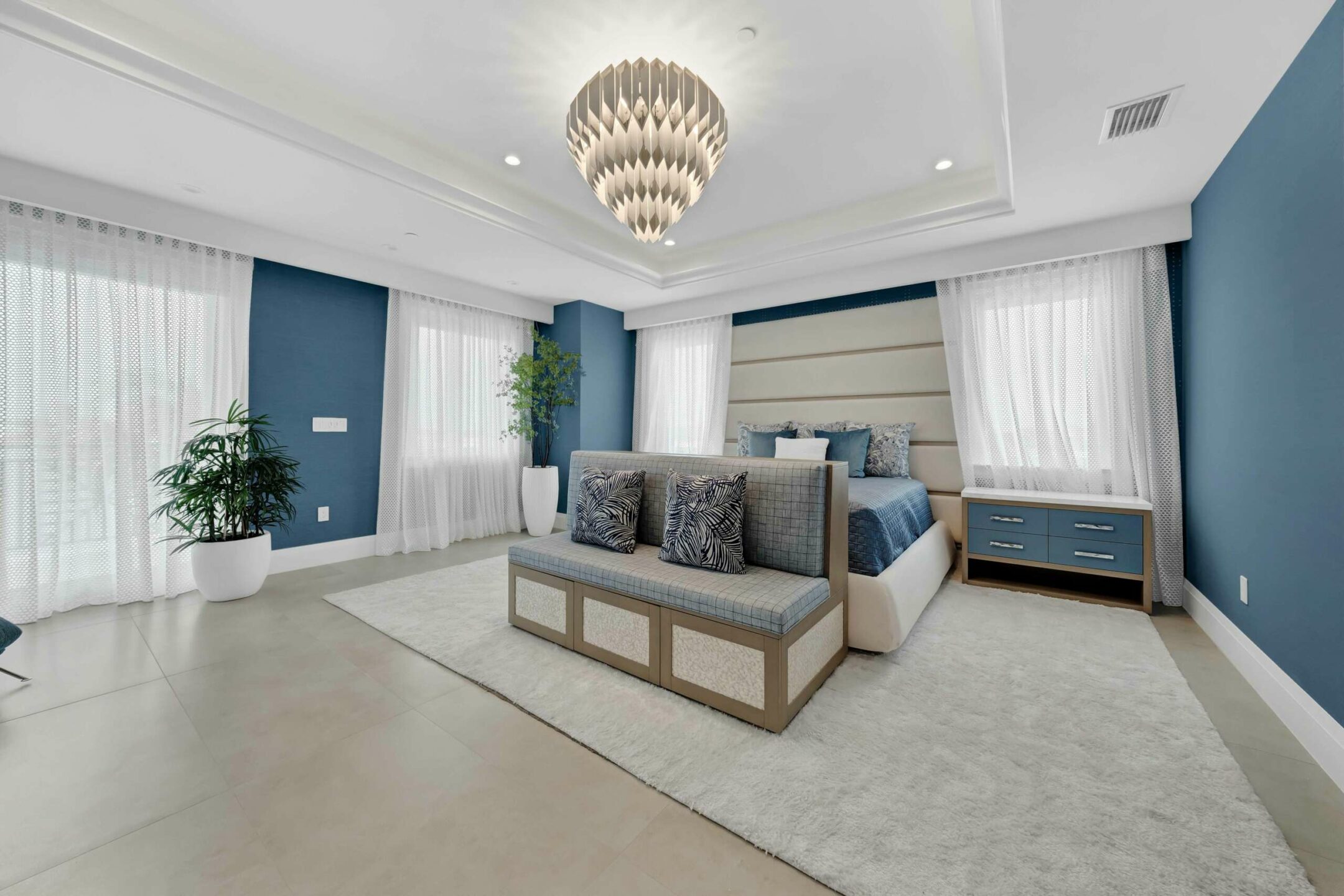 The master bedroom includes a cove ceiling and waterfronr balcony. Credit: Platinum Luxury Auctions 