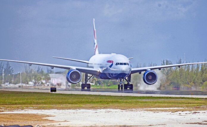 A British Airways flight lands in Grand Cayman