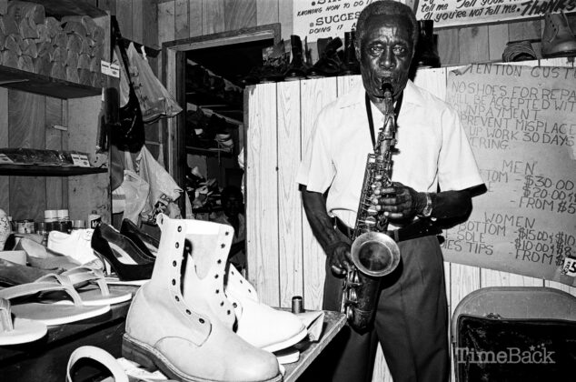 The late Wellesley Augustus Howell playing his saxophone in his iconic Shedden Road shoe shop