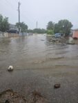 Rainy weather to ease after weekend flight disruptions Flooding on Canberra Street, Bodden Town on Saturday. - Photo: Supplied