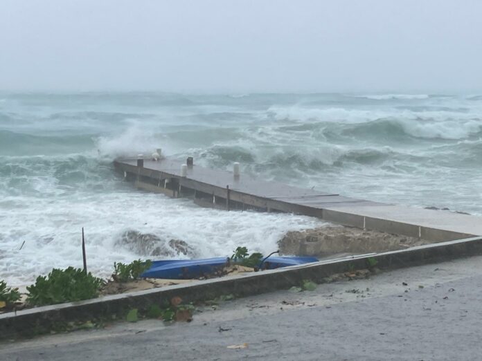 Seas were tumultuous off West Bay Beach around 10am on Thursday. - Photo: James Whittaker