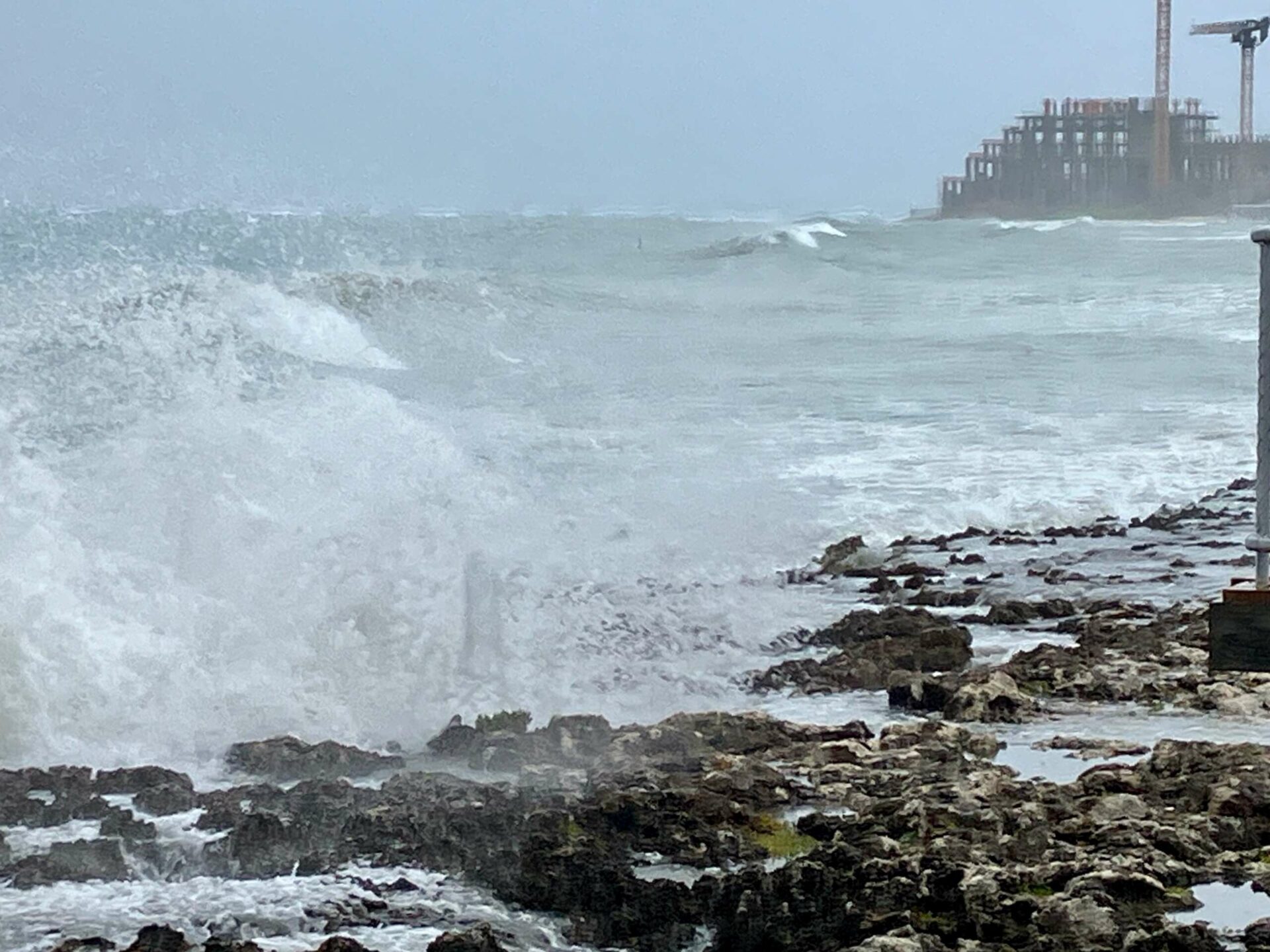 Wave action in George Town Harbour Thursday morning. - Photo: James Whittaker