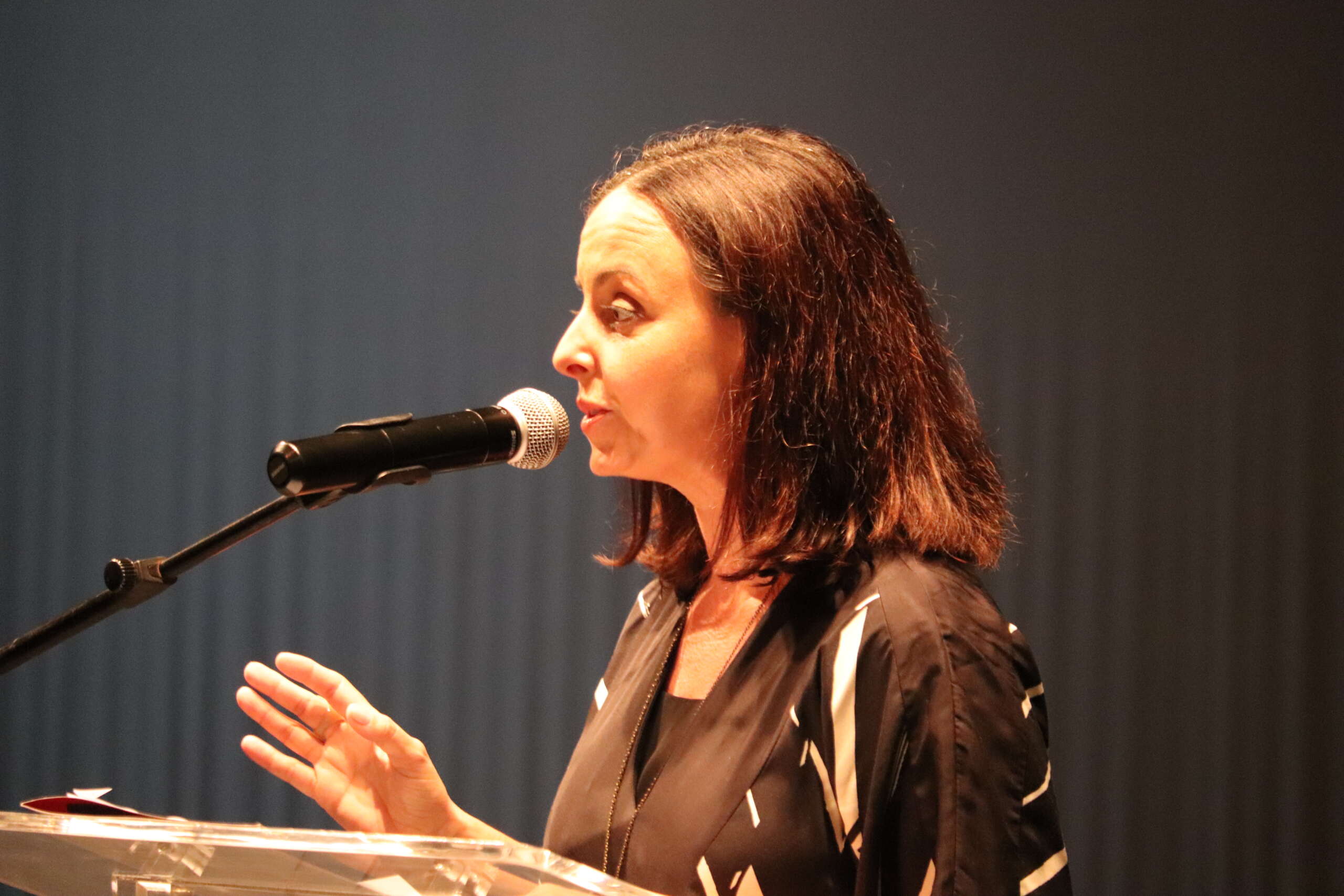 Natalie Urquhart delivers remarks from the Cayman National Cultural Foundation and the National Gallery of the Cayman Islands Boards and Staff.