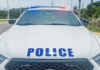 Third man arrested in text message bank scam probe RCIPS police car