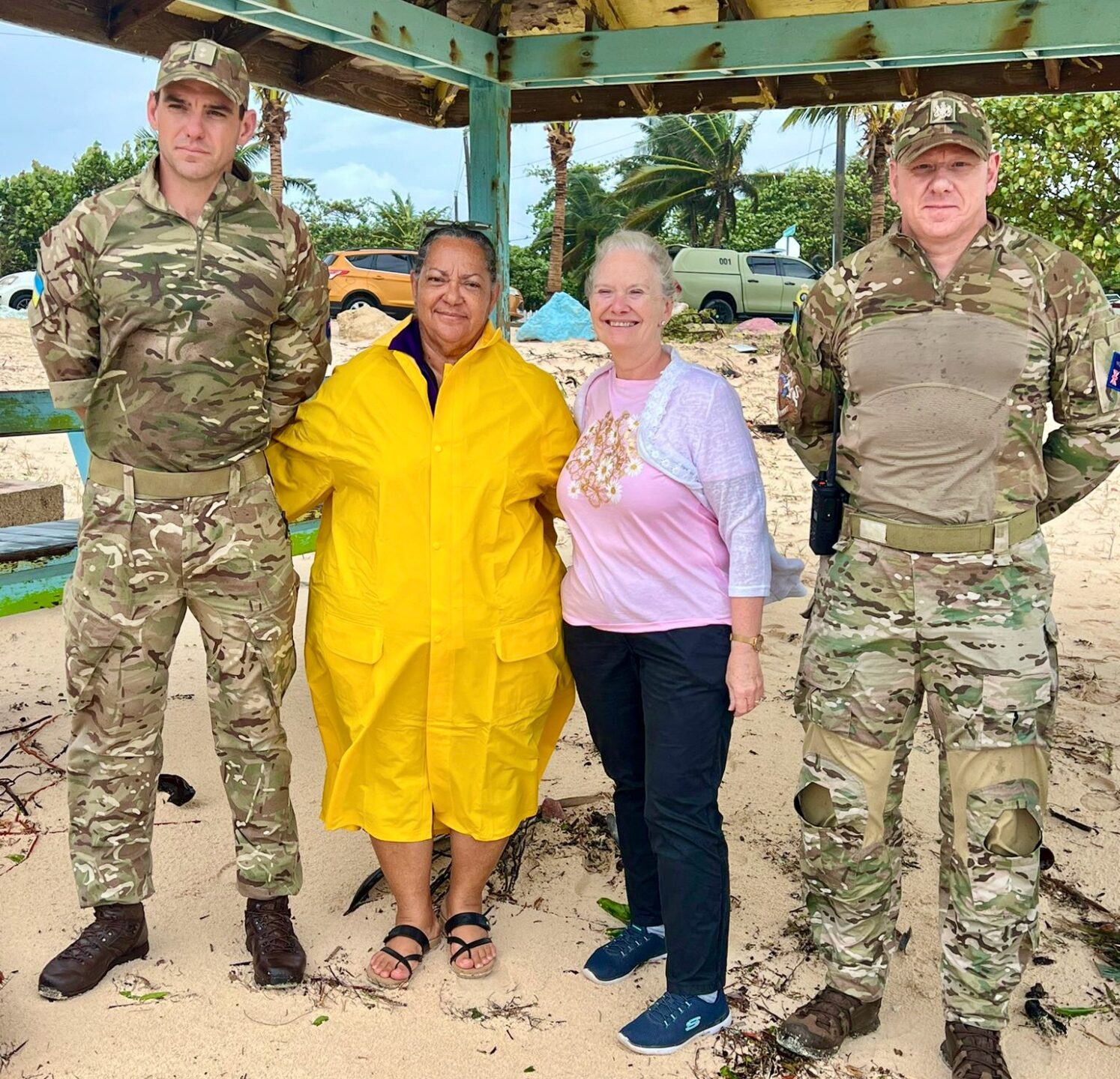 Flanked by regiment officers, Premier Juliana O'Connor Connolly and Governor Jane Owen surveyed the damage from Hurricane Beryl on Thursday. - Photo: Supplied