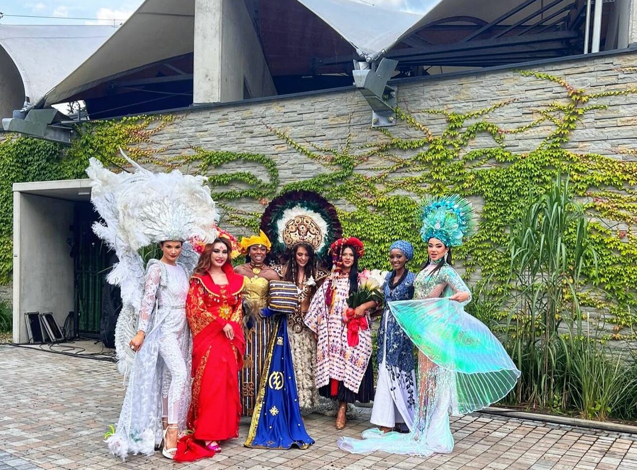 Jaci Patrick, far left, poses with some of the 2024 Miss Supranational contestants in their national costumes.