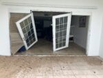 Storm surge batters down shutters at oceanfront condo complex