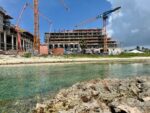 Grand Hyatt developer plans water sports dock on Seven Mile The coastline around the half-built Grand Hyatt resort is part sandy beach, part shallow pools and part ironshore. - Photos: James Whittaker