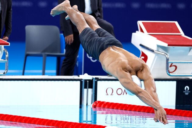 Jordan Crooks jumps in the pool in Paris