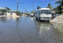 Schools closed Monday as public warned to expect flooding Standing water due to high tides on Bronze Street in George Town last week