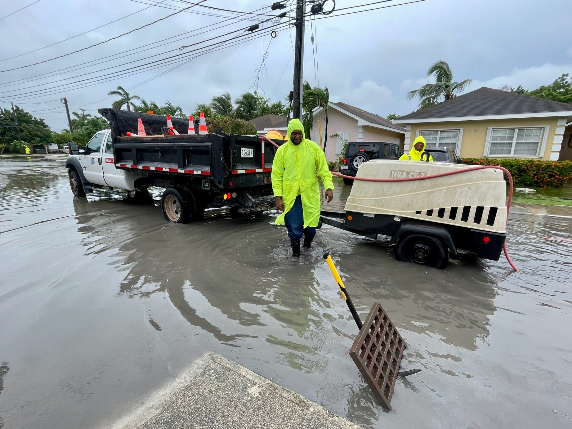 NRA engineers clear drains near Smith Road Villas in George Town. - Photo: Sarah Bridge