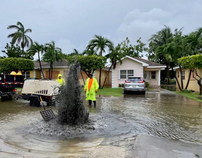 drain clearing Engineers clear drains in George Town, Wednesday, to manage flooding. The NRA says a national strategy is needed to better manage storm water. - Photo: Sarah Bridge
