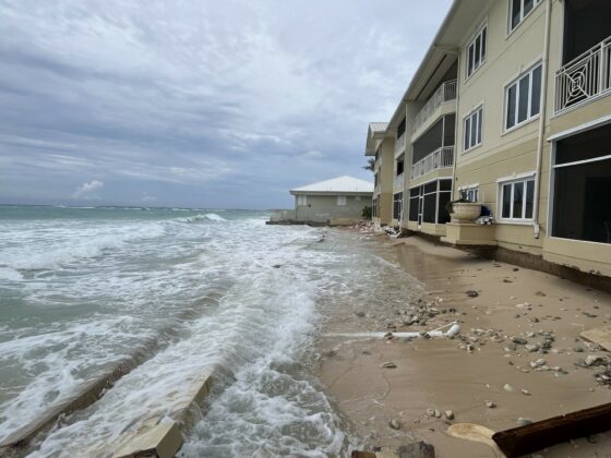 Waves reach the oceanfront units at Laguna del Mar on Seven Mile Beach.