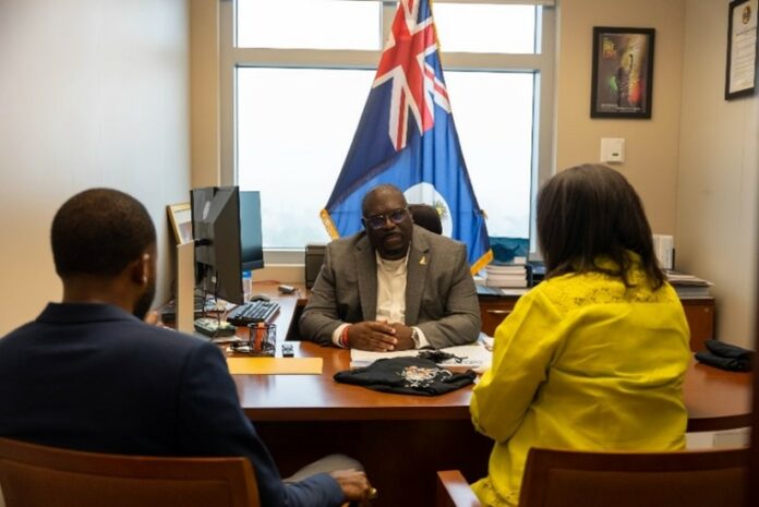 The Min. of Culture, the Hon. Dwayne Seymour meet with Donna Myrie, Chair of Batabano Cayman Carnival and Rashad Rankin, the new Executive Creative