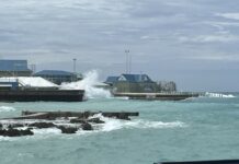 Downgraded hurricane forecast still projects above-average season Waves associated with Hurricane Helene come ashore by the port in George Town in September 2024.