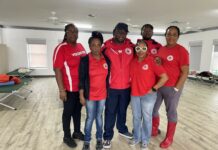 Red Cross volunteers ready for anything with an overnight shift at the shelter Shelter manager Marsha Thompson (third from right) with volunteers at the Red Cross hurricane shelter in George Town