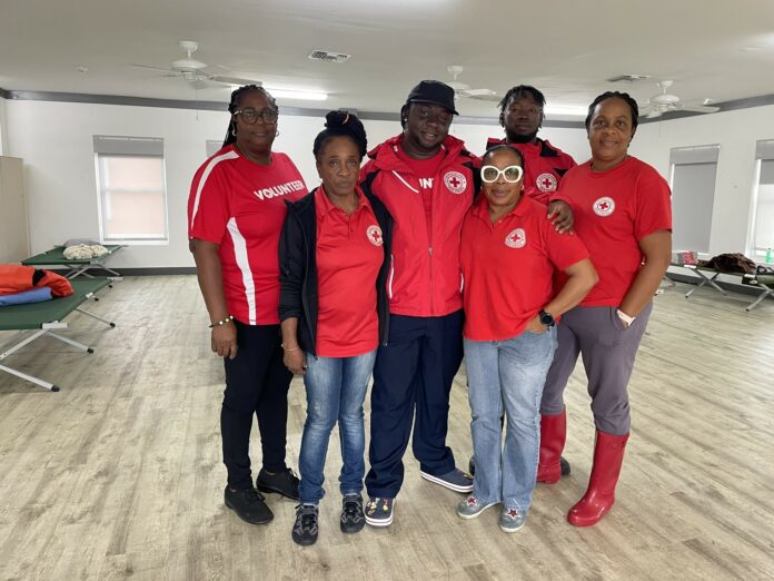 Shelter manager Marsha Thompson (third from right) with volunteers at the Red Cross hurricane shelter in George Town