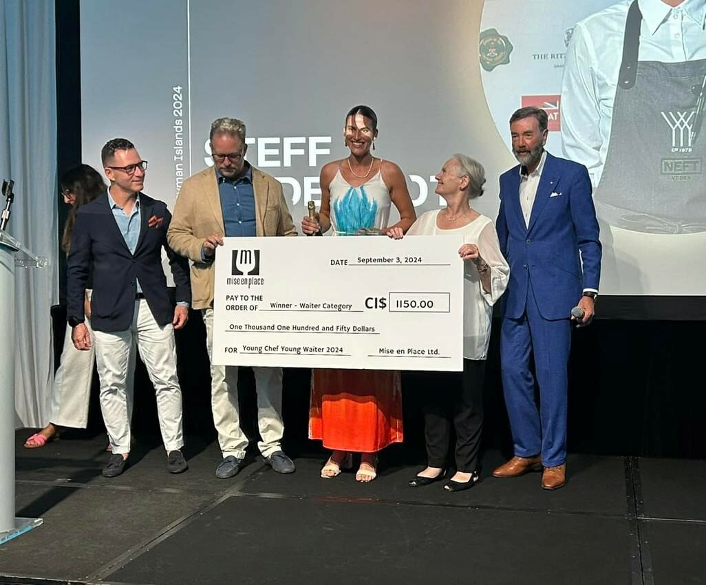 Steff Mcdermot receives her winning cash prize as Young Waiter 2024. - Photo: Supplied