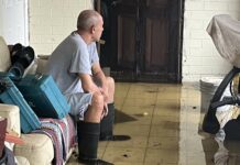 George Town residents flooded out by Tropical Storm Helene A resident sits in a flooded property on Washington Boulevard. - Photos: Simon Boxall