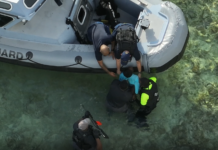 Woman charged with alleged assaults on police This RCIPS image shows the moment police detained a female suspect after a nearly three-hour-long standoff in George Town. - Photo: Submitted