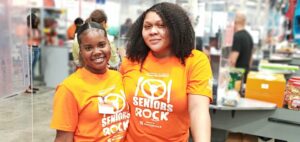 Cost U Less employees wear orange to support MOW