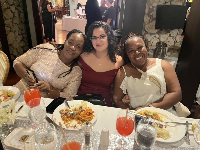 Office Manager of ADACI Lauren Lucas-Currie, centre, sits with two caregivers at the Caregivers Appreciation Dinner. - Photo: Simon Boxall