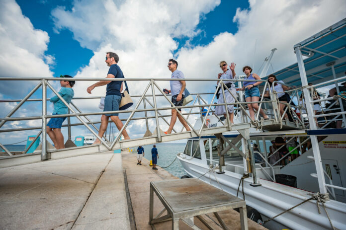 Cruise ship passengers arrive on shore at George Town. - Photo: File