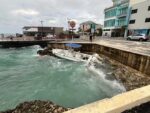 Dive boat breaks moorings amid rough seas in George Town A surface trough brought choppy seas and washed ashore this dive boat that slipped its moorings on Sunday afternoon. - Photo: Simon Boxall