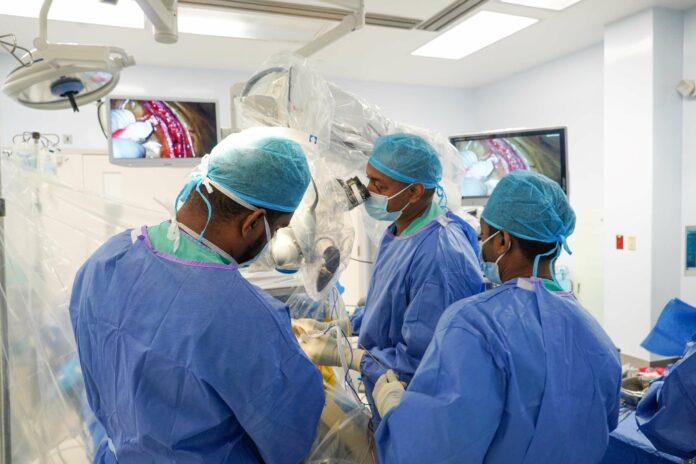 Dr Cooke performs HSA's first awake craniotomy for brain tumour resection with the assistance of a team of surgeons, anaesthesiologists, nurses, and OR technicians.