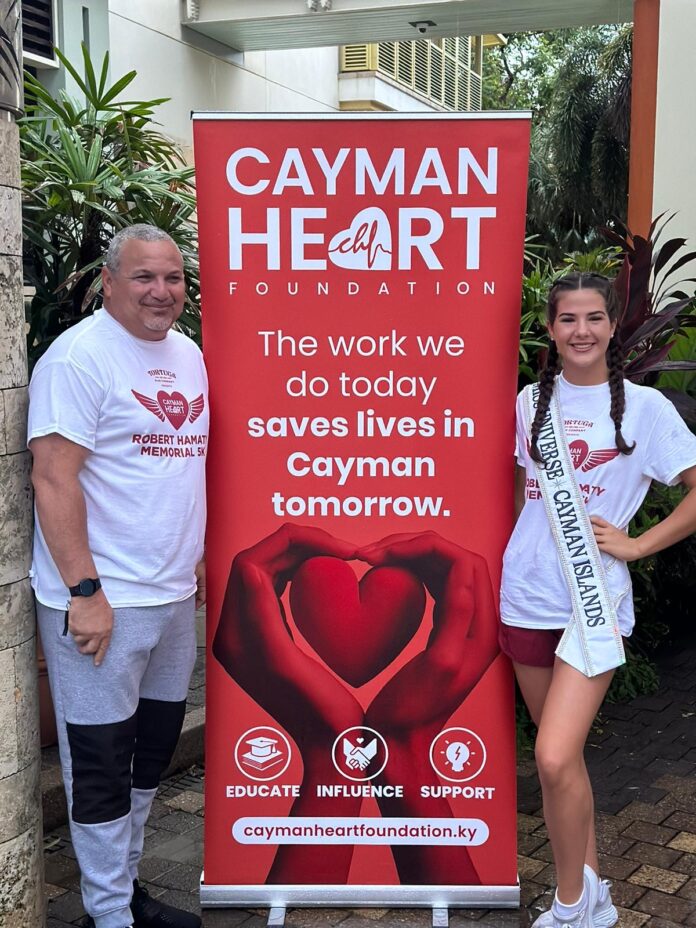 Hon.Deputy Governor Franz Manderson poses with Miss Universe Cayman Islands Raegan Rutty