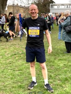 Former Governor Martyn Roper shows off his medal after the Bath marathon, in which he completed a month before his cancer surgery. - Photo: Supplied