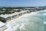 Threat of legal action in Laguna del Mar’s bid for protective seawall Beach erosion has meant that waves now crash directly onto the walls of Laguna del Mar on Seven Mile Beach