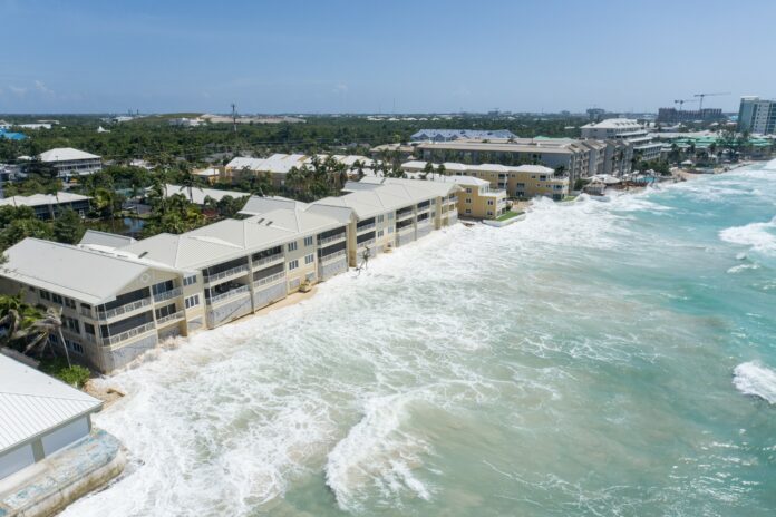 Beach erosion has meant that waves now crash directly onto the walls of Laguna del Mar on Seven Mile Beach