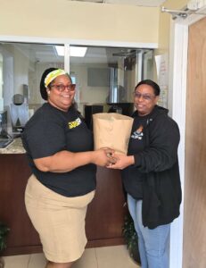 Subway employee delivering sandwiches to member of the Royal Cayman Islands Police Service-1