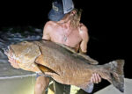 Fisherman reels in ‘once-in-a-lifetime fish’ from beach James Costa with a red mangrove snapper, commonly known in Cayman as a ‘mangra’