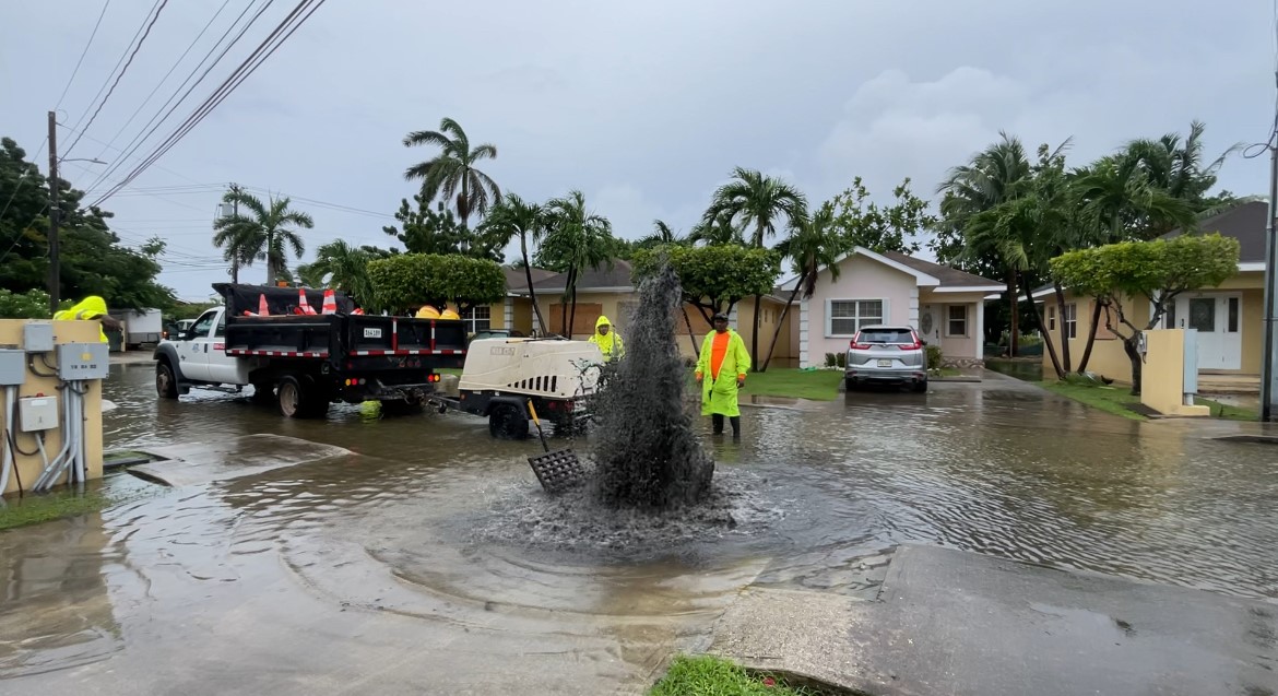 Workers clearing drains 