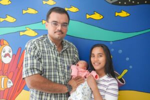Parents Lyzle and Lee with their baby, Ella.