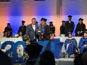CIAA’s Ms. Ivis Matute receives her bachelor’s degree certificate from the International College of the Cayman Islands
