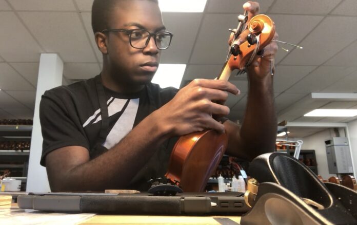 Zachary Allen is learning the craft of string instrument repair, a service lacking locally. - Photo: Submitted