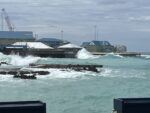 Approaching cold front will bring waves to west side In this file photo, waves hit the George Town harbour area. - Photo: Simon Boxall