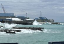 Approaching cold front will bring waves to west side In this file photo, waves hit the George Town harbour area. - Photo: Simon Boxall