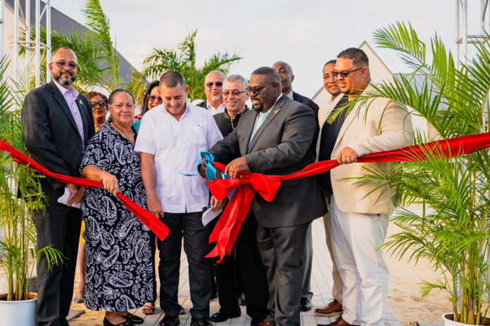 Wellness Minister Dwayne Seymour cuts the ribbon to open the long-delayed Poinciana Rehabilitation Centre. -Photo: Taneos Ramsay