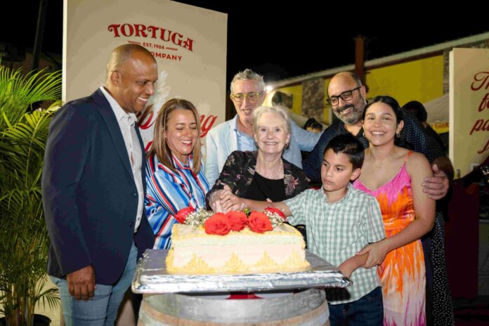 Tortuga Board and Family Members cut the 40th anniversary cake with HE the Governor