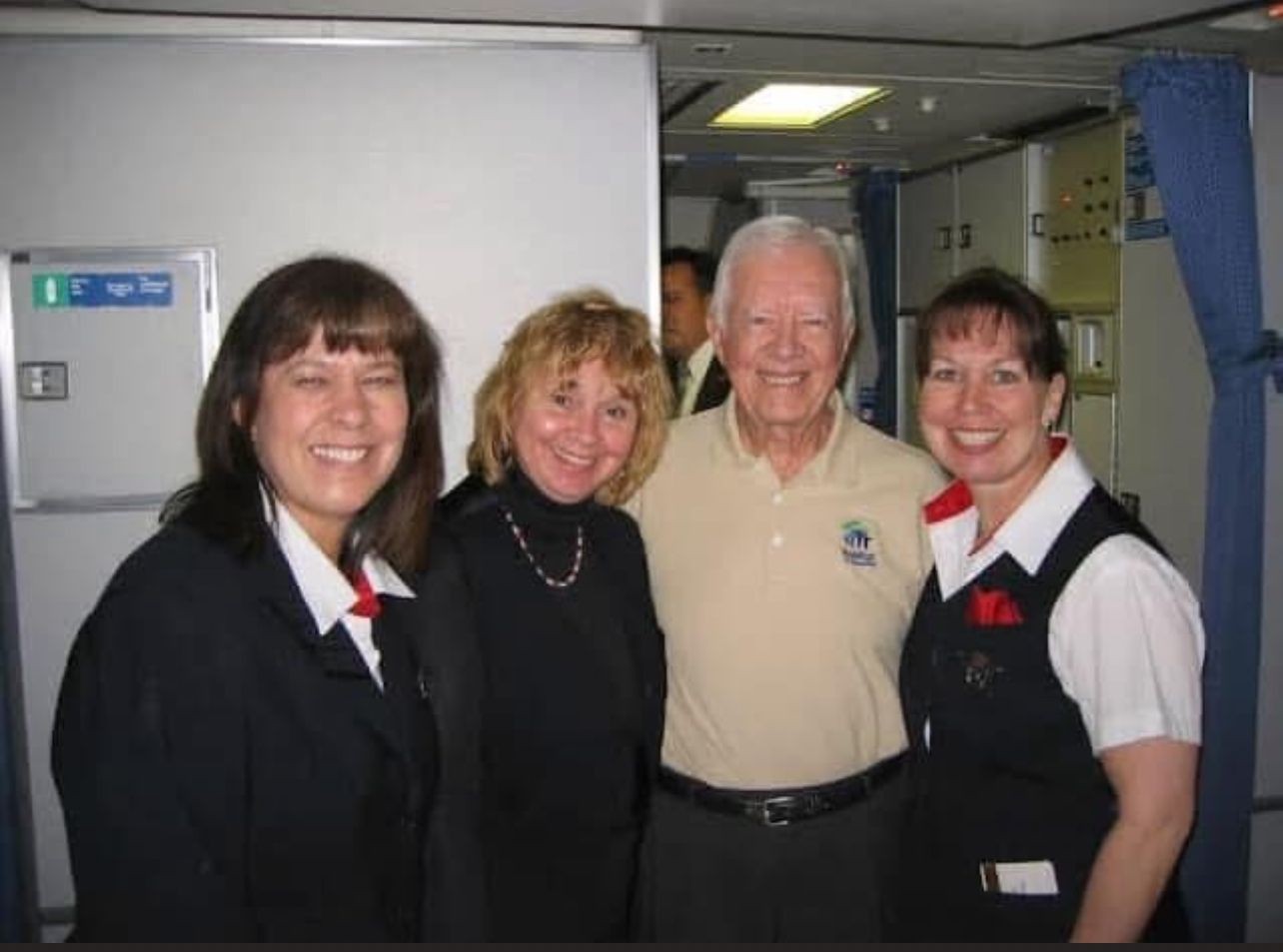 Flight attendant Val Kegel (second from left) treasures her memories of the many times she flew with Jimmy Carte