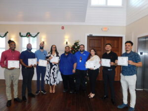 ATC Trainees celebrate graduation ceremony with CKIA Airport Manager Joshua Burke and ORIA ATC Manager Alastair Bird.