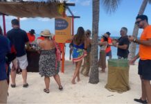 Bam! Top chef Emeril Lagasse cooks up a storm at Cayman Cookout Guests at the Beach Bash event at Rum Point were treated to Emeril Lagasse's piri piri shrimp bundles