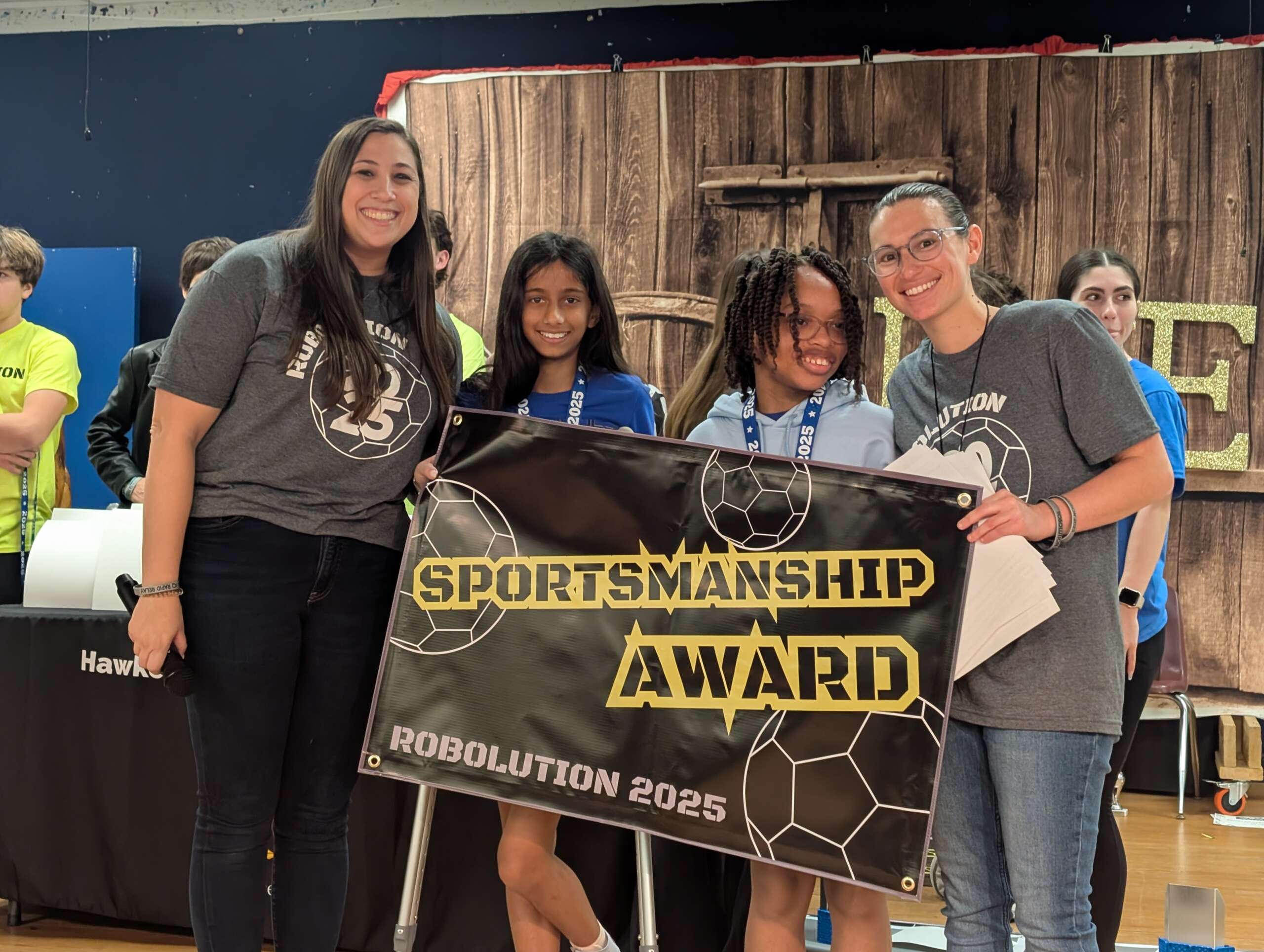 Winning students Omya Arora (second left) and Brianne Atkinson (second right) with event organiser