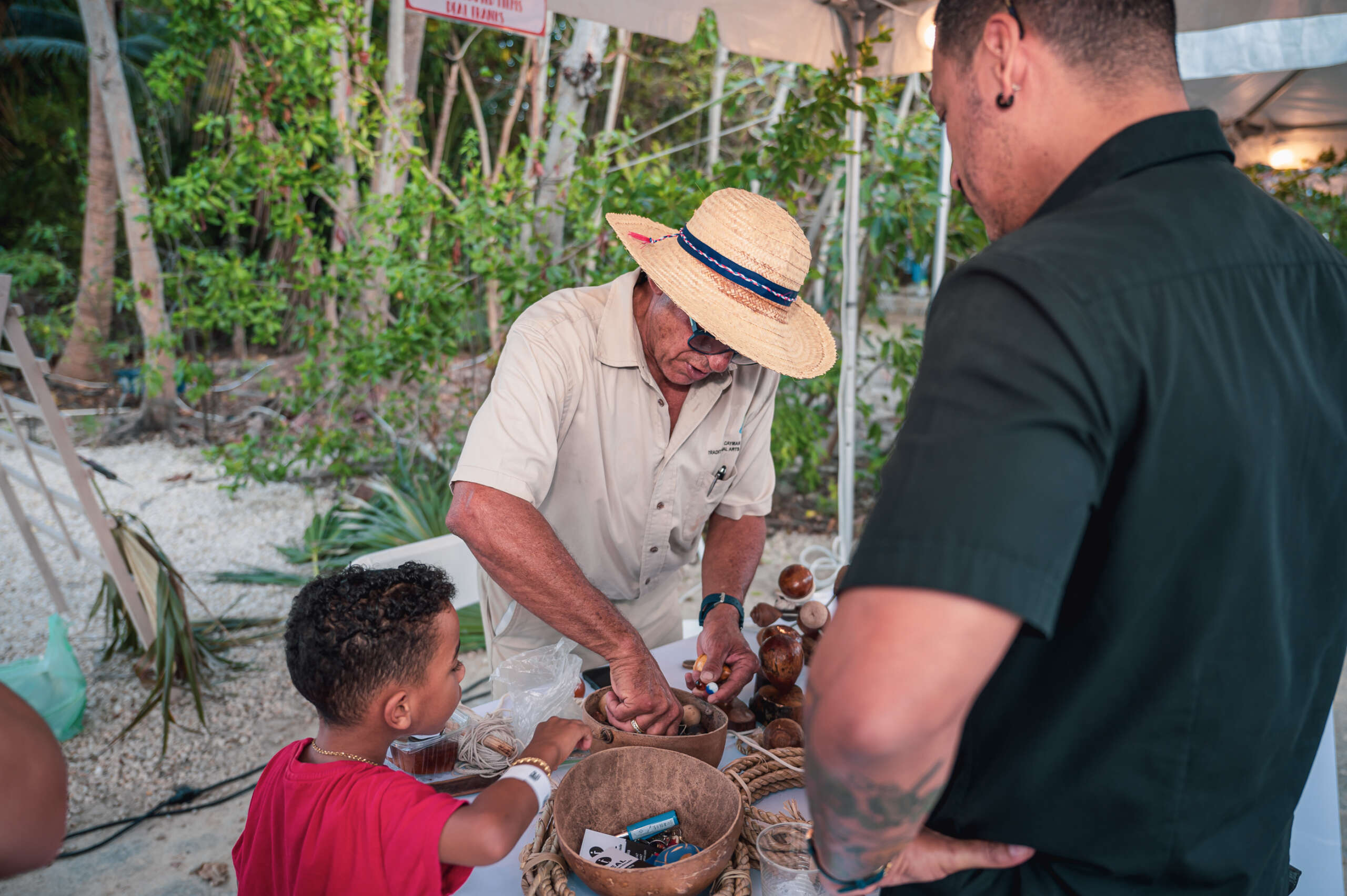 Attendees, young and old, learn Caymanian traditions at the annual CayFest from CNCFl. - Photo: File