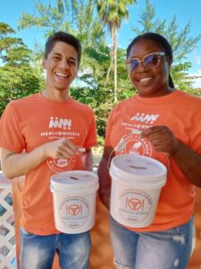 Volunteers proudly assist MOW Cayman during the Change For Change Coin Drive